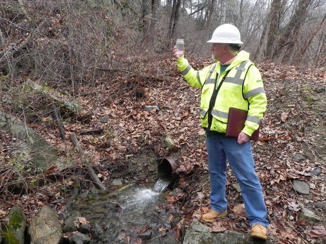 Stormwater sample being collecter