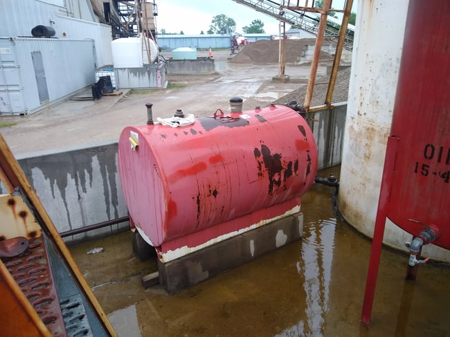 secondary containment on rainy day secondary containment wall filling with rainfall