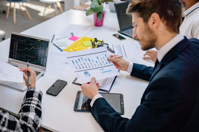 investor reviewing graphs investor
