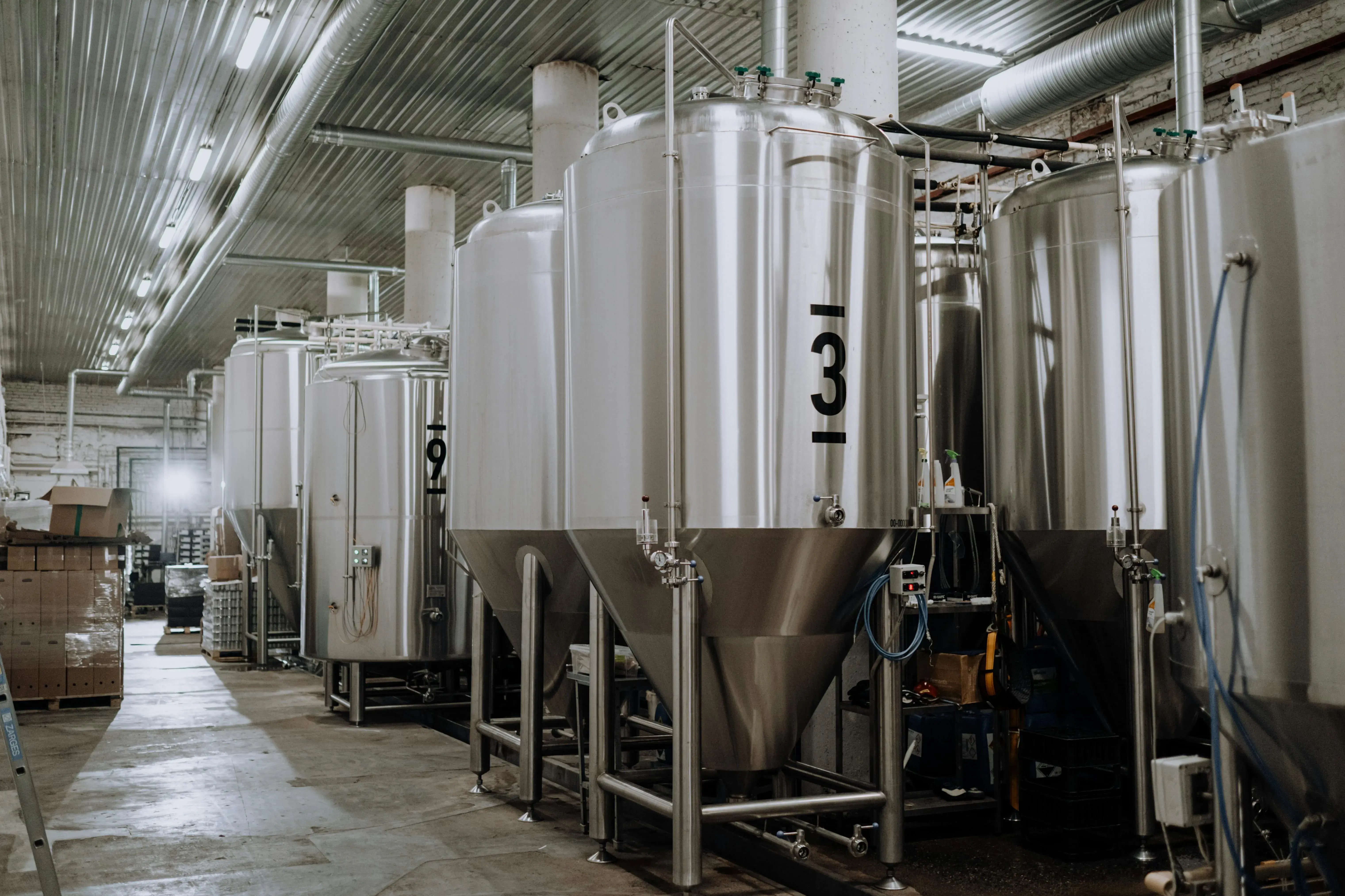 Large metal vats holding oil