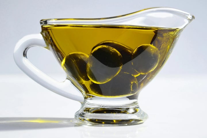 Olive oil in glass pitcher