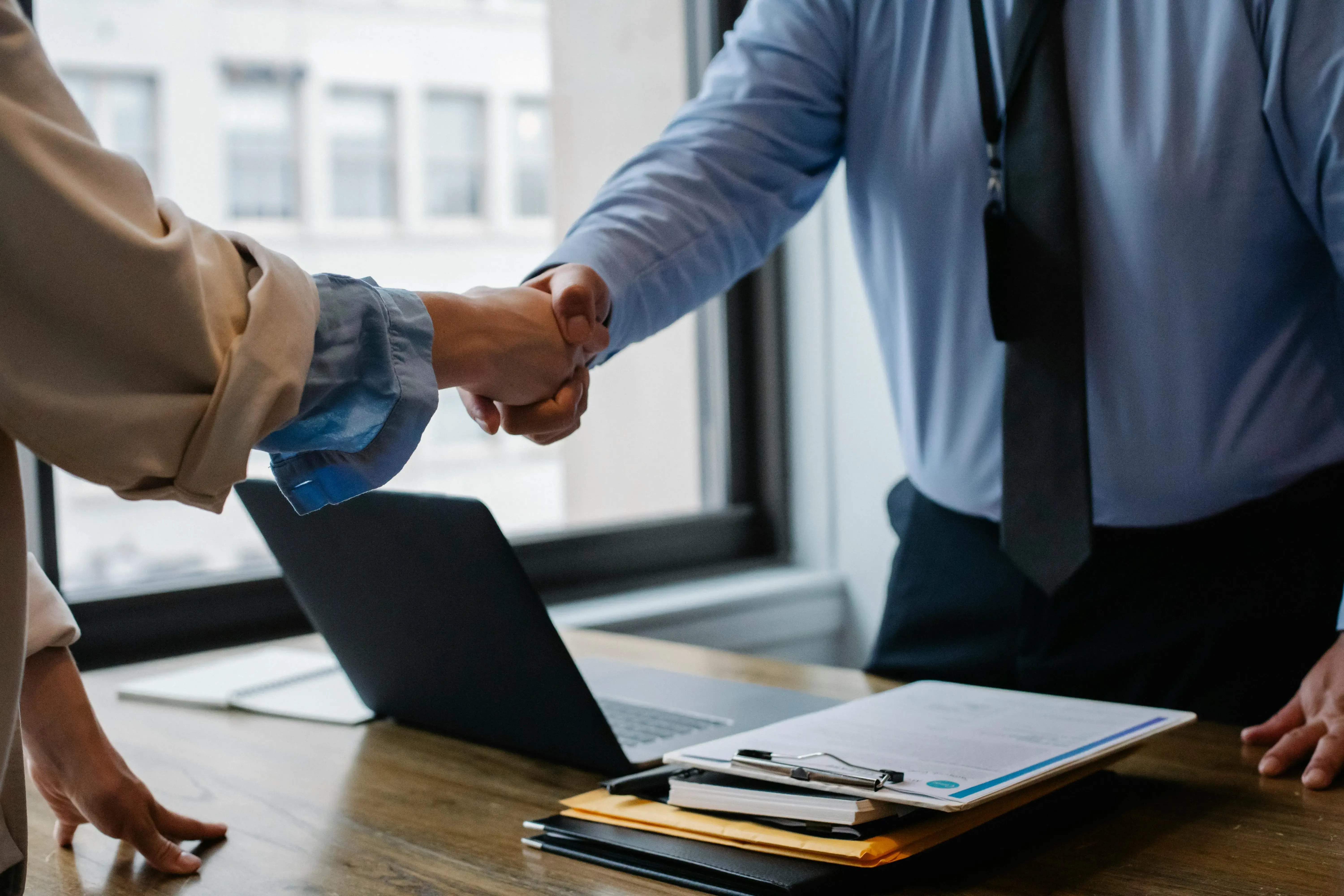 RMA shaking hands with colleague